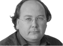 A profile photograph of Reinhard Schneider