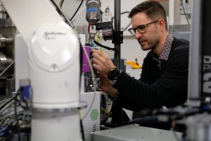 Male scientist works on instrumentation