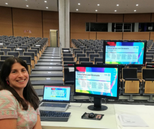 Conference Officer Nathalie working at a virtual event in an empty Auditorium.