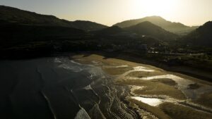 Drone shot of Bilbao coastal sands during sunset