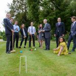 Thornton group plays a leisurely game of croquet.