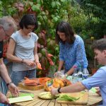 Former group members muck in to prepare a surprise birthday dinner. PHOTO: Iouri Motorine