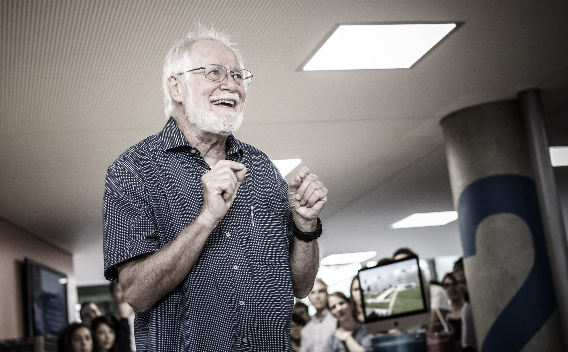 Photo of Jacques Dubochet giving a talk