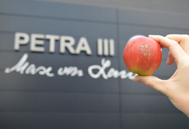 The beamlines at PETRA III logo and Max von Laue hallwith an DESY-Day apple