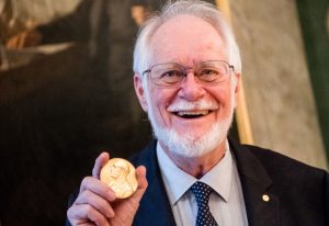 Jacques Dubochet holding his Nobel medal during Nobel week. PHOTO: Alexander Mahmoud ©Nobel Media AB 2017