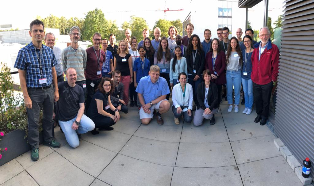 A group of scientists and students on DESY campus.