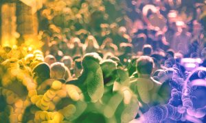 Microscopy images of bacteria against a backdrop of a crowd of humans.