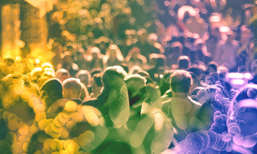 Microscopy images of bacteria against a backdrop of a crowd of humans.