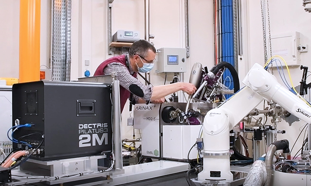 Scientist working on an instrument of the MASSIF-1 beamline