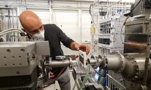 A scientist is carefully handling capilars at the P12 beamline at EMBL Hamburg.