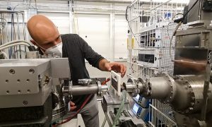 A scientist is carefully handling capilars at the P12 beamline at EMBL Hamburg.