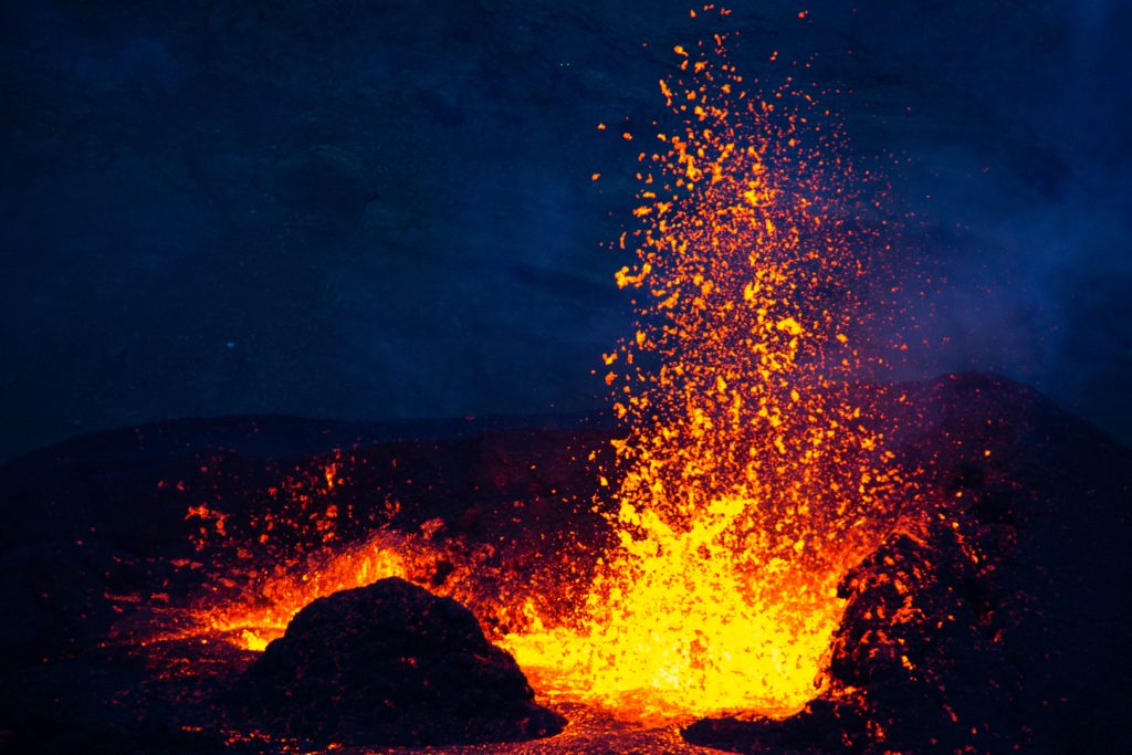 Photograph of hot lava at a volcano.