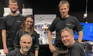Five scientists in black t-shirts