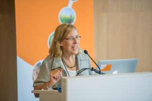 Female scientist at a podium