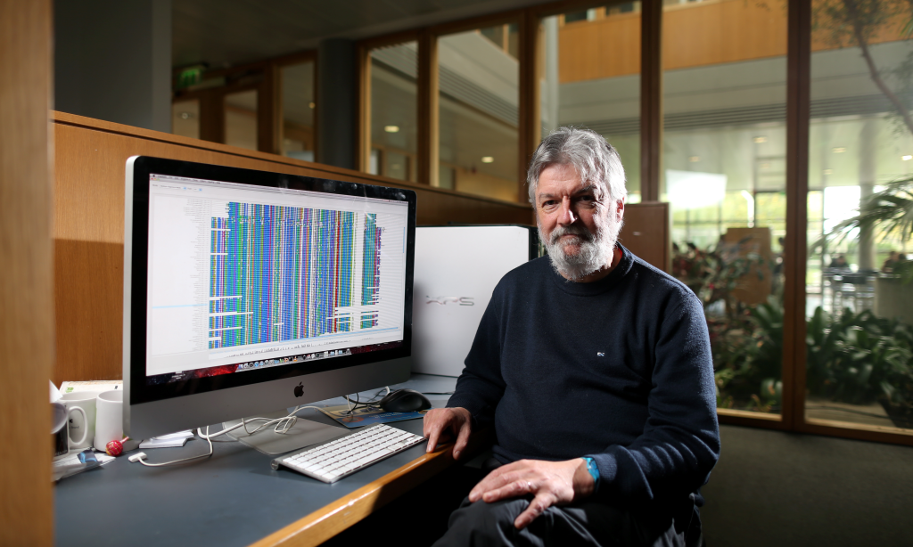 Male scientist in front of a computer screen