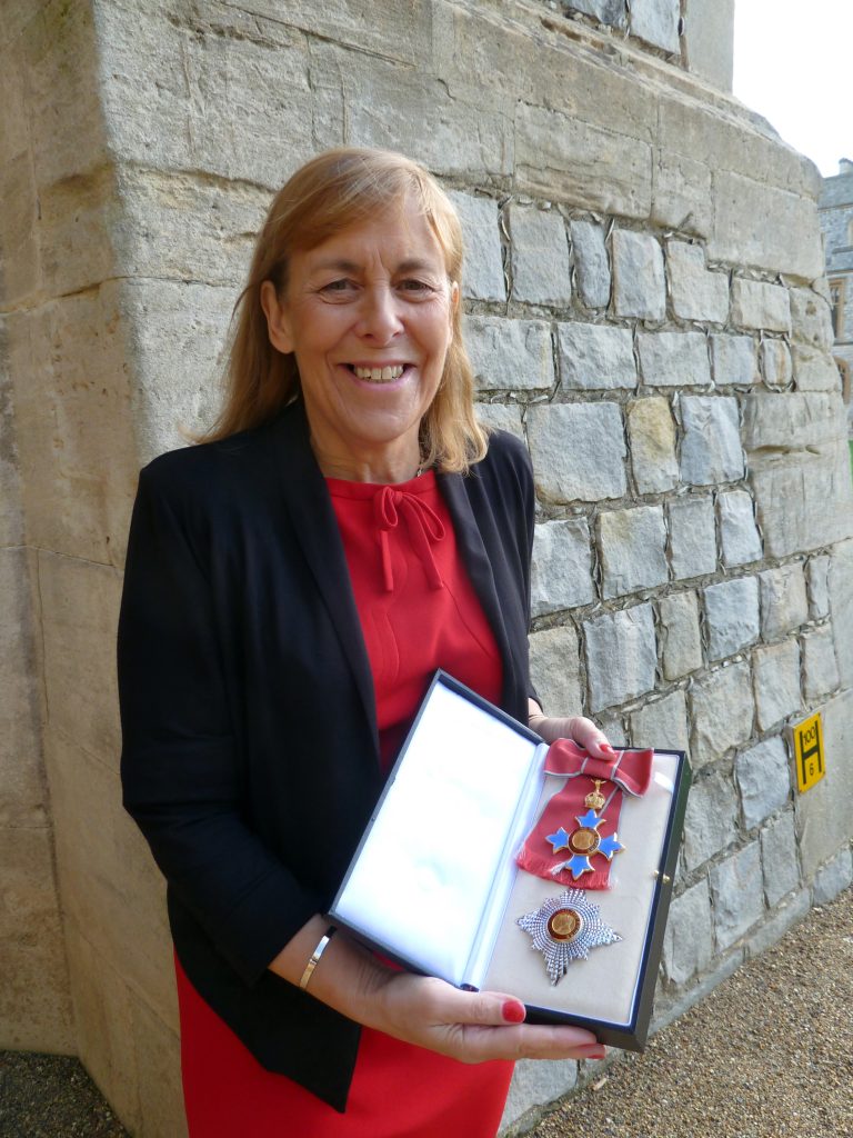 Woman holding a medal