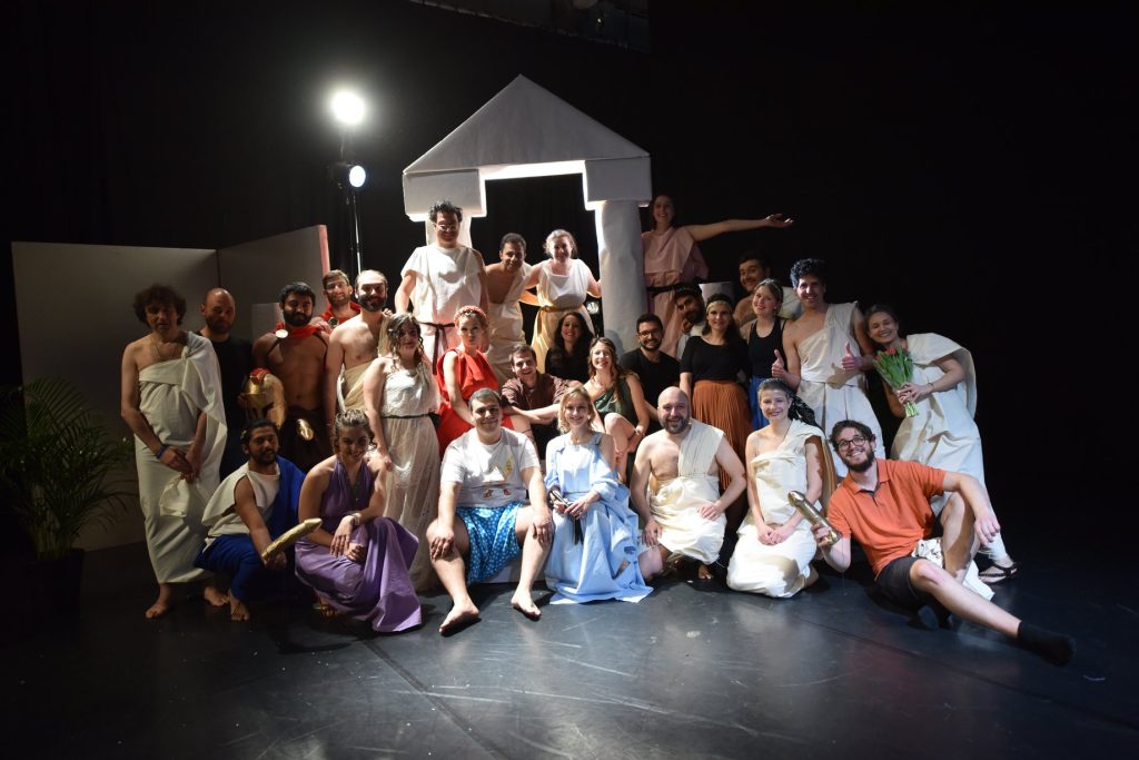 Group photo of theatre actors and workers.