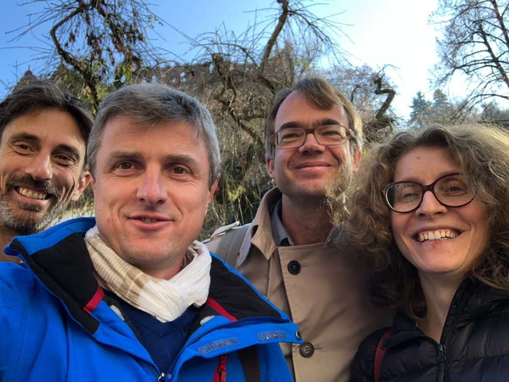 Outdoor selfie showing four scientists