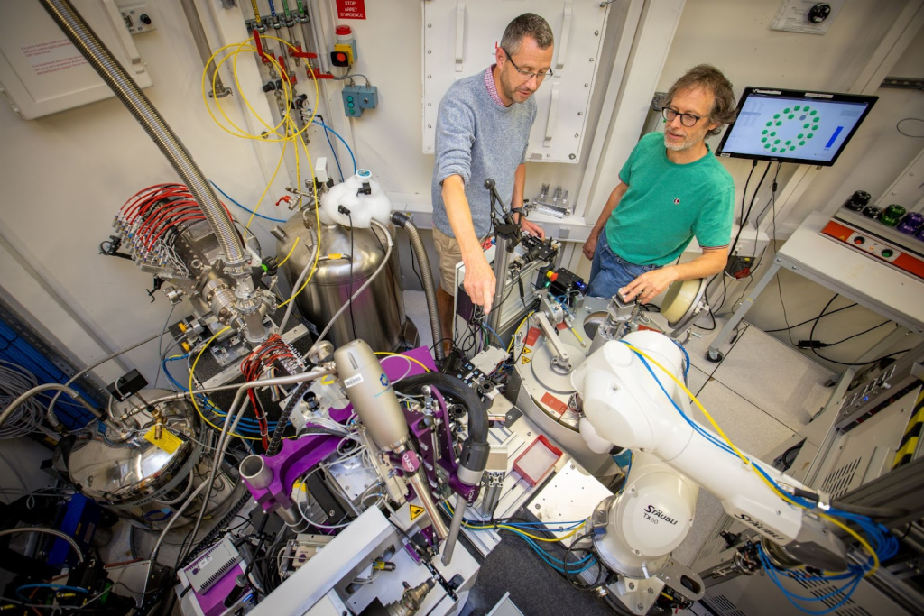 Two male engineers working with lab equipment.