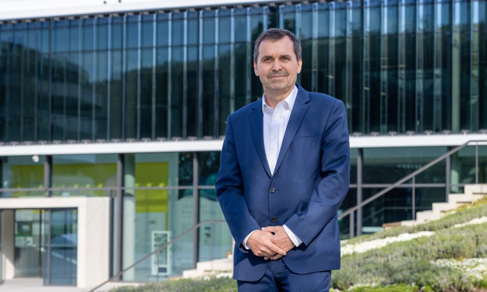 Juergen Bauer standing outside an EMBL building.