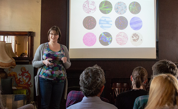 Woman standing in front of a presentation 