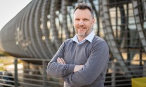 Man standing in front of a building