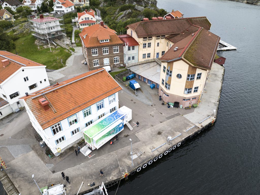 A drone image showing an overhead view of the AML truck parked close to the shore at Kristineberg, Sweden. 