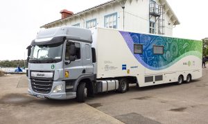 A truck bearing the TREC mobile services logo and illustration on its side.