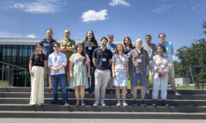 Group photo showing ARISE fellows standing outdoors on a set of stairs.