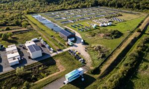 Aerial view of the CEREEP Ecotron IDF facilities and the Advanced Mobile Lab parked on site.
