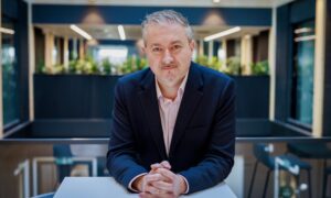 Person leaning on a table