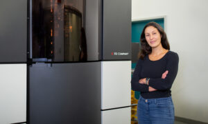 Scientist standing next to a cryo-ET machine
